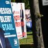 Wahlplakate der Spitzenkandidaten in Hessen.