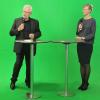 Karl-Heinz Raguse und Katrin Albsteiger vor dem „Green-Screen“ im Studio der Firma Freiraum.  	