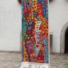Dieses Kunstwerk, ein original Stück Berliner Mauer, von James Rizzi wird bald in Neuburg zu sehen sein. 