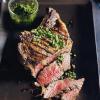 Hier finden Sie das Rezept für Ribeye Steak mit Kräutersoße vom Grill.