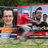 Wahlplakate mit Porträts der NRW-Spitzenkandidaten von CDU, Ministerpräsident Hendrik Wüst (links), und SPD, Thomas Kutschaty, in Köln.