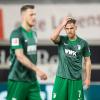 Augsburgs Florian Niederlechner, Jeffrey Gouweleeuw und Andre Hahn waren nach der Niederlage gegen den VfB enttäuscht.