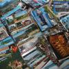 Geben Sie es zu, irgendwo liegen Berge von Postkarten. Von wem? Woher? Von wann? Oder haben Sie eine Lieblingspostkarte an der Küchenwand hängen? Als Lesezeichen im aktuellen Krimi liegen? Lassen Sie es uns wissen!  	
