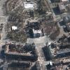 Eine Stadt als Symbol des russischen Angriffskrieges: Dieses  Satellitenbild zeigt die Folgen des Luftangriffs auf das Theater von Mariupol und dessen Umgebung.  

