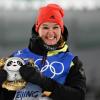 Denise Herrmann freut sich bei der Flower Ceremony über den Gewinn der Goldmedaille.