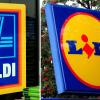 Logos der deutschen Discounter Aldi (l) und Lidl in Großbritannien.