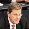 Bundesaußenminister Guido Westerwelle (FDP) verfolgt im Deutschen Bundestag die Reden der Opposition. dpa