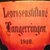 Das Foto eines alten Schilds von 1910 erinnert an die einstige Leprosenstiftung in Langerringen.