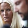 Haakon, Crown Prince of Norway, and his wife Crown Princess Mette-Marit speak to the press after visiting youths wounded in the Utoeya island massacre at the Ringerike hospital, northwest of Oslo, on July 24, 2011.  AFP PHOTO / SCANPIX NORWAY / Trond Reidar Teigen   ***NORWAY OUT***