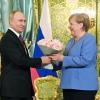 Blumen zum Abschied: Angela Merkel war im August 2021 zum 19. und letzten Mal als Kanzlerin bei Wladimir Putin zu Gast. 