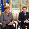 Bundeskanzlerin Angela Merkel und der französische Staatspräsident Nicolas Sarkozy bei einem interview im Elysee Palast in Paris. Foto: Jesco Denzel dpa