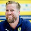 Oliver Roggisch, Sportlicher Leiter der Rhein-Neckar Löwen, sitzt in der Trainingshalle.