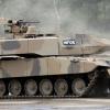 Umstrittener Exportartikel: ein Kampfpanzer Leopard 2 A7+ der Firma Krauss-Maffei Wegmann bei einer Militärübung der fiktiven Einheit „WFOR“.  	