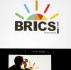 Ein Mann fotografiert das Brics-Logo in Johannesburg eine bunte aufgehende Sonne. Ob die  Erweiterung der Allianz  die Erwartungen der dann elf Mitglieder erfüllt, ist nicht ausgemacht.  