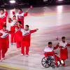Eine Inszenierung? Fröhlich schwenkten die Mitglieder der kleinen nordkoreanischen Mannschaft ihre Fähnchen, als sie im Rahmen der Paralympics-Eröffnungsfeier das Stadion betraten.