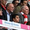 Joachim Löw (l-r),Karl-Heinz Rummenigge und Ulli Hoeneß, sitzen auf der Tribüne.