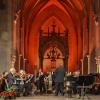 Dirigent Juri Gilbo und die Philharmonia Frankfurt beim Liberation Concert in der Klosterkirche St. Ottilien.