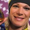 Mit Gold in der Hand kann Maria Höfl-Riesch die Abfahrt ganz gelassen angehen.