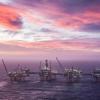 Der Himmel erleuchtet in lila und pink hinter dem Johan Sverdrup Ölfeld in der Nordsee.