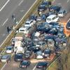 Autowracks stehen am Samstag (19.11.2011) auf der Autobahn A31 bei Heek nach einer Massenkarambolage.