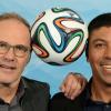 Reinhold Beckmann und Giovane Elber sind zwei der zahlreichen Experten, Moderatoren und Kommentatoren, die während der WM 2014 in Brasilien berichten. ARD und ZDF übertragen sämtliche der 64 Partien live.
