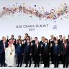 Zum Abschluss des G20-Gipfels lächeln die Teilnehmer in die Kamera. 