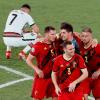 Belgische Spieler feiern den 1:0-Sieg, während Portugals Cristiano Ronaldo enttäuscht reagiert.