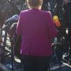 Angela Merkel erklärt Journalisten, dass es noch dauern wird. 	 	