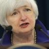 Janet Yellen ist eine mächtige Frau. Mit ihrer Entscheidung, die Zinsen zu erhöhen, schreibt die US-Notenbankchefin Geschichte.  	