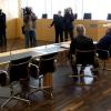 Siegfried C. (r, mit Kappe) im Gerichtssaal: C. ist angeklagt seine sechs Jahre jüngere Frau Ende 2012 auf dem Gelände der katholischen Kirche in Braunlage erschossen zu haben.