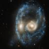 Hubble liefert einzigartige Bilder. Hier zeigt es  verschmelzende Galaxien, die aussehen wie ein kosmisches Gesicht.