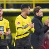 Dortmunds Salih Özcan, Trainer Edin Terzic und Emre Can (l-r) nach einem Spiel.