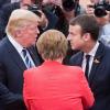 Angela Merkel im Gespräch mit Donald Trump und Emmanuel Macron.