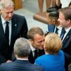 Angela Merkel wird am Rande des UN-Klimagipfels von Emmanuel Macron und Harrison Ford (links) begrüßt.