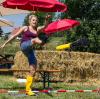 Gummistiefel-Weitschießen, Wettmelken oder Bierkastendrücken. Die Disziplinen der "Bauernhof-Olympiade" bieten nur wenig Verwechslungsgefahr mit denen der Olympischen Spiele.