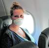 Wie fühlt es sich an, wieder zu fliegen? Unsere Autorin hat den Test gemacht – natürlich mit Maske.  