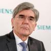 Siemens-Vorstand Joe Kaeser hält an den Lieferung für ein riesiges Kohlebergwerk in Australien fest.