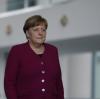 Angela Merkel vor der Pressekonferenz am Donnerstag.  	 	