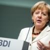 Bundeskanzlerin Angela Merkel spricht in Berlin beim "BDI-Tag der Deutschen Industrie 2014". Wirtschaftsforschungsinstitute geben ihr eine Mitschuld am aktuellen Abschwung.