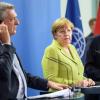 Der Hohe Flüchtlingskommissar der Vereinten Nationen, Grandi (l-r), Kanzlerin Merkel und der Generaldirektor der Internationalen Organisation für Migration, Swing, bei einer Pressekonferenz.