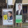 Grünen-Kandidat Ludwig Hartmann und CSU-Kandidat Mathias Neuner gehen in die Stichwahl.