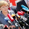 Nach dem Besuch einer Flüchtlingsunterkunft äußert sich die Bundeskanzlerin vor Pressevertretern in Heidenau.