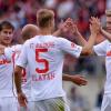 Die Augsburger Paul Verhaegh (l-r), Tobias Werner, Ragnar Klavan und Jan-Ingwer Callsen-Bracker jubeln nach dem 1:0-Sieg in Nürnberg.