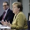 Bundeskanzlerin Angela Merkel informiert mit Markus Söder (rechts) und Michael Müller auf einer Pressekonferenz über neue Corona-Maßnahmen.