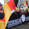 Teilnehmer der Demonstration des Vereins "Gemeinsam Stark Deutschland" zogen mit Fahnen durch Magdeburg (Sachsen-Anhalt).