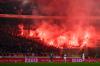 Die Fans des FC Augsburg zünden Pyrotechnik während des Spiels.