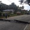 epa03910353 Filipinos stand next to a cracked road after a 7.2-magnitude earthquake in the town of Loboc, Bohol province, Philippines, 15 October 2013. A magnitude-7.2 earthquake struck the central Philippines killing at least four people and causing roads to crack and structures to collapse, officials said. The tremor occurred 2 kilometres south-east of Carmen town in Bohol province, 640 kilometres south of Manila, according to the Philippine Institute of Volcanology and Seismology. It was felt in the nearby provinces of Cebu, Negros, Masbate, Leyte and Iloilo and as far as the southern region of Mindanao, the institute said. EPA/ROBERT MICHAEL POOLE +++(c) dpa - Bildfunk+++