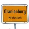 Das Ortsschild mit der Aufschrift „Oranienburg Kreisstadt“ steht an der Stadtgrenze.