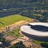 Die Luftaufnahme zeigt das Olympiastadion und den Umliegenden Olympiapark.