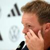 Bundestrainer Julian Nagelsmann kämpft während der DFB-Pressekonferenz mit den Tränen